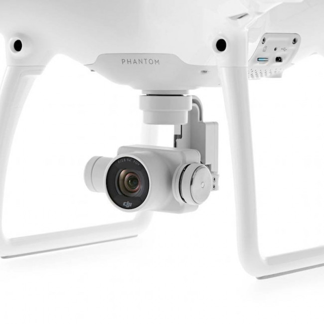 Квадрокоптер DJI Phantom 4 + 2 доп. аккумулятора + авто З/У Квадрокоптер DJI Phantom 4 + 2 доп. аккумулятора + авто З/У